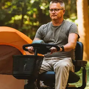 A man using a mobility scooter outdoors