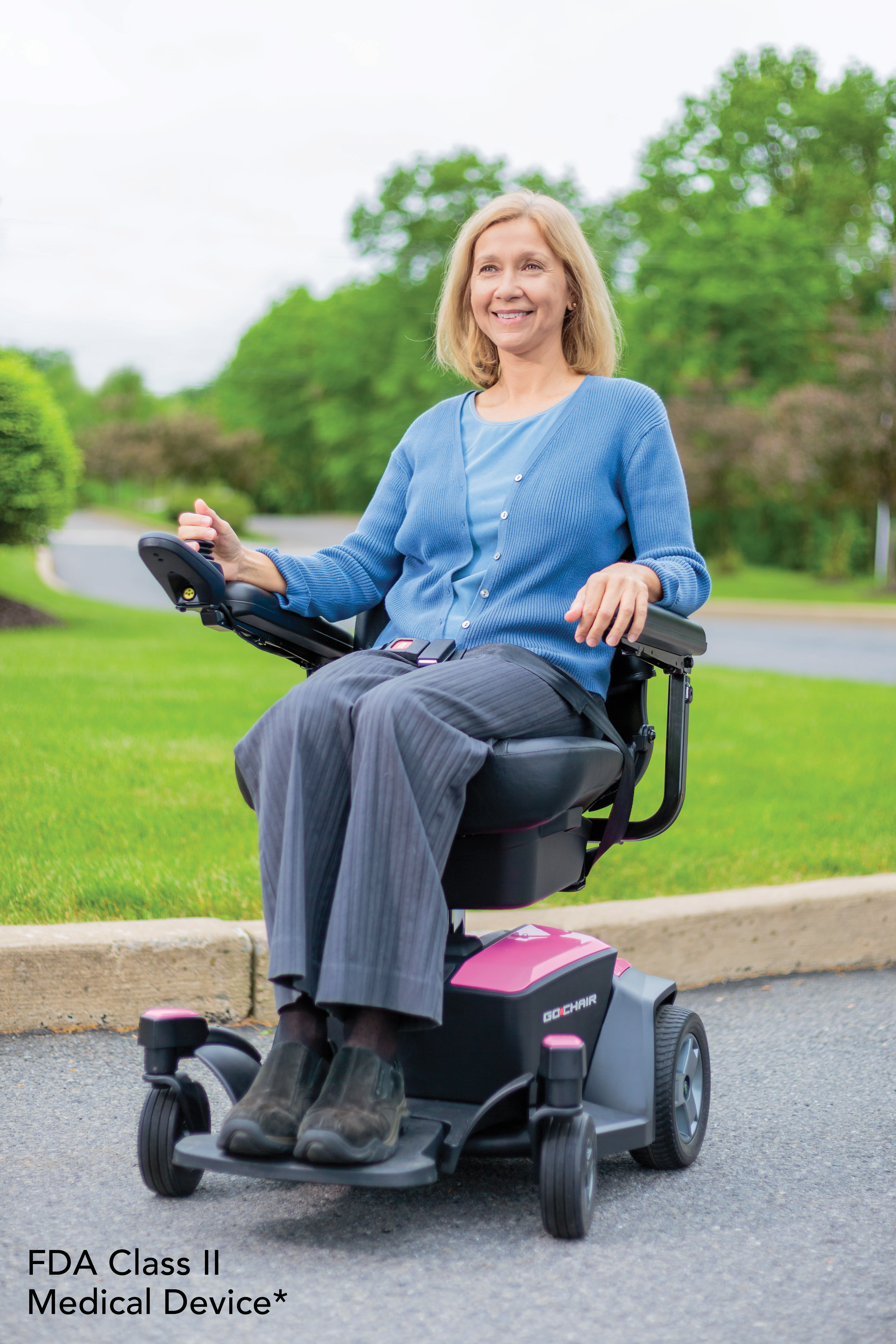 A woman using a power chair outdoors